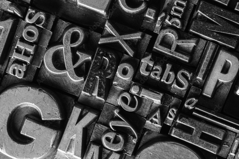 Close-up detail of historic movable type used in letterpress printing
